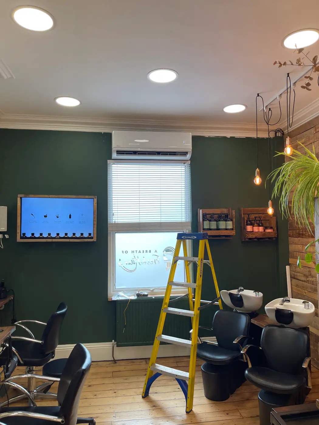 Commercial air conditioning by our Bolton engineers Air conditioning installed in a barbershop